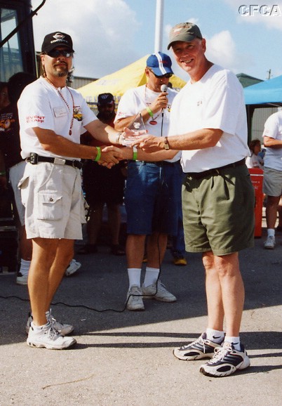 033.John Harrell accepting his and Sharon's C1 trophy.JPG