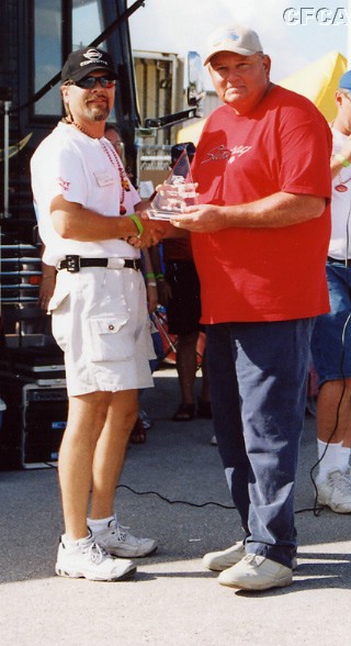038.Bruce Johnson accepting his and Sandra's C2 trophy.JPG