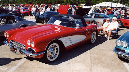 010.A beautiful '61 and her proud owners.JPG