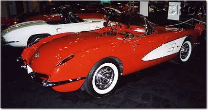 046.Where 2 Corvettes from each generation glistened under the lights.JPG