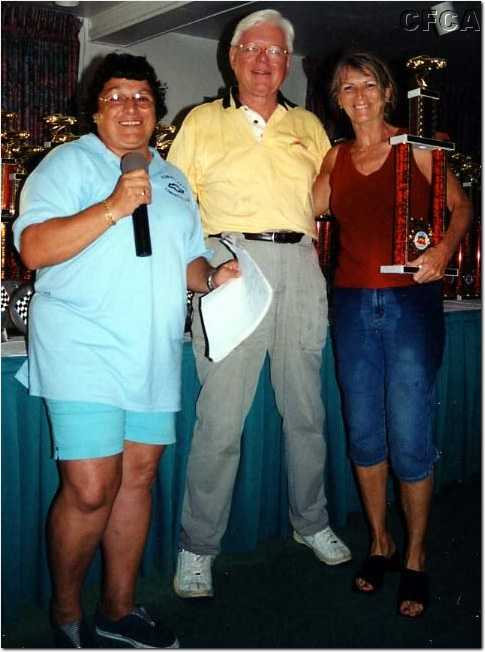 076.Terry accepting her C4 trophy from Marie and Dave.jpg
