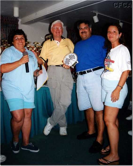 079.Tom and Sherry accepting their C5 trophy from Marie and Dave.jpg
