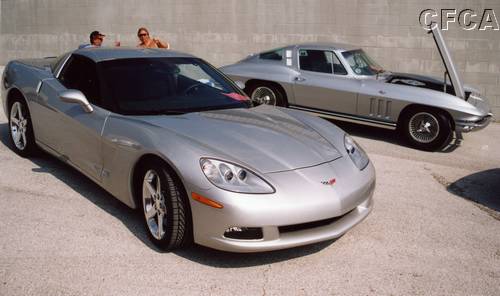025.Don and Betty Ashe were resplendent with their matching Silver '65 and '05 Vettes.JPG