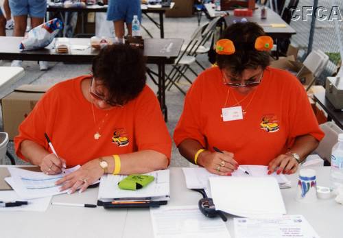 074.Joan and Lisa hard at work, tabulating scores.JPG