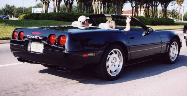 022.Henry and Cindi enjoy the beautiful morning in their beautiful black '94 convertible.JPG