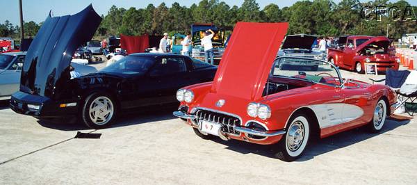 002.30 years of Corvette history separate Rich's black '89 and Mark's red '59.JPG