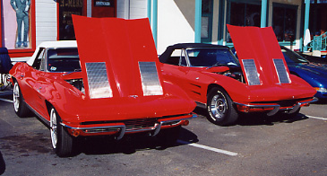 024.Here's something you don't get to see everyday---two perfect, red '63 Convertibles.JPG