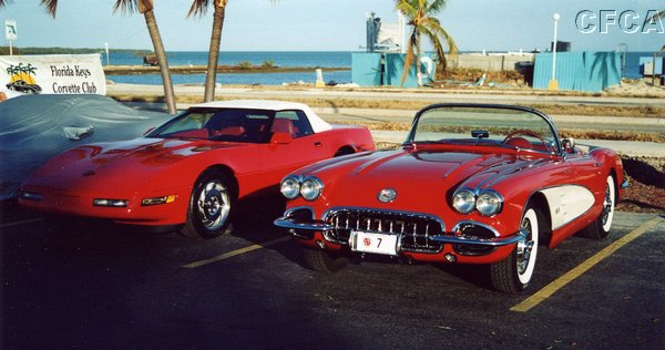 002.Mark's Roman Red '59 and her younger, C4 kissing cousin.JPG