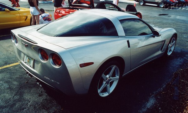006.With his awesome, but understated Light Tarnish Silver C6 Coupe.JPG