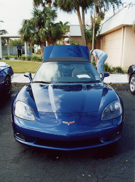 009.Jon's and Pat's new Luxo Blue C6 Convertible gets some TLC before judging.JPG