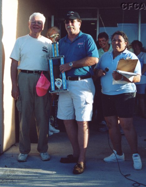 050.Gary accepts his and Joan's C5 trophy from Dave.JPG