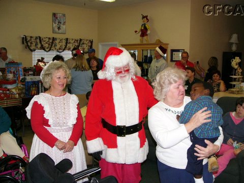 13 Santa and Mrs Claus with Janet and Michael.JPG