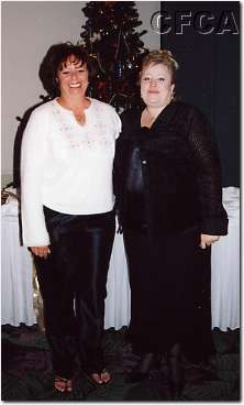 008.Joan and Joyce enjoy the holiday festivities.JPG