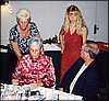 003.Pat and Shelley confer over costs as Jon prepares party.JPG