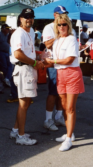 051.Davon Wellhofer accepting her and Jeff's C5-Early trophy.JPG