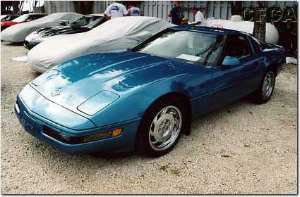 032.John's and Kathy's Aqua '92 braving the rains, sans cover.jpg