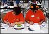 074.Joan and Lisa hard at work, tabulating scores.JPG