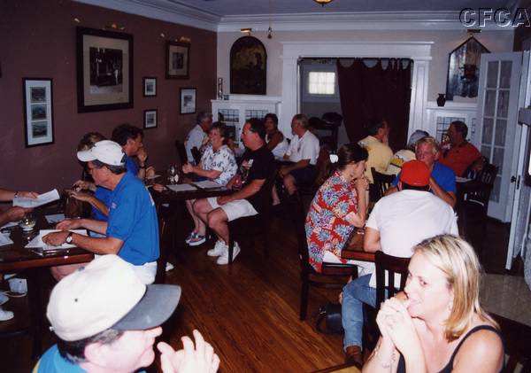 047.-----The rest of the gang got busy eating and drinking.JPG