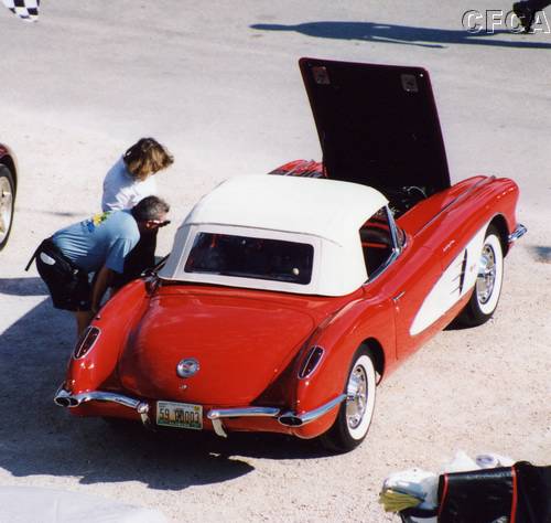 009.Mike and Debbie checking out Mark's '59 making sure it's clean.JPG