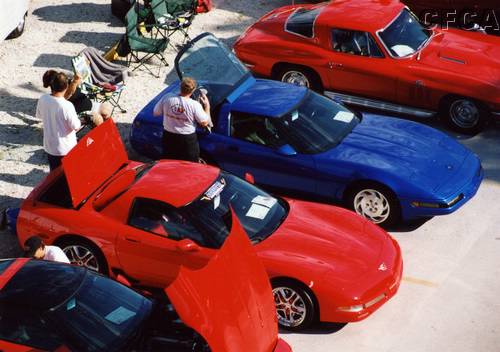 010.BJ, Barry and Mark all work on their cars, while JoAnn looks on.JPG