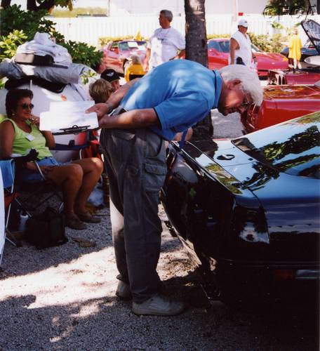 059.Lisa bites her lip as none other than Dave McLellan, himself, inspects Kim's flawless ZR1.JPG