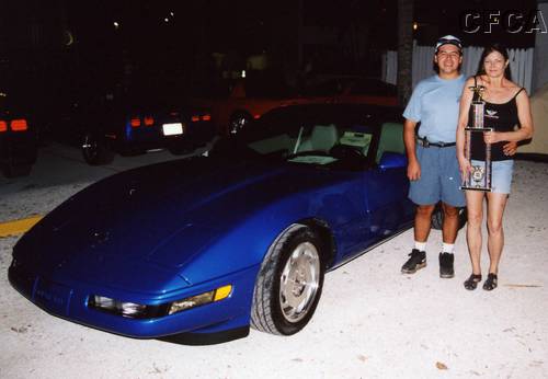 082.A very happy Ken and Barbara with their trophy and Corvette, making Don and Tina proud.JPG