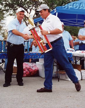 032.Henry accepting his C4 trophy (on the run).JPG