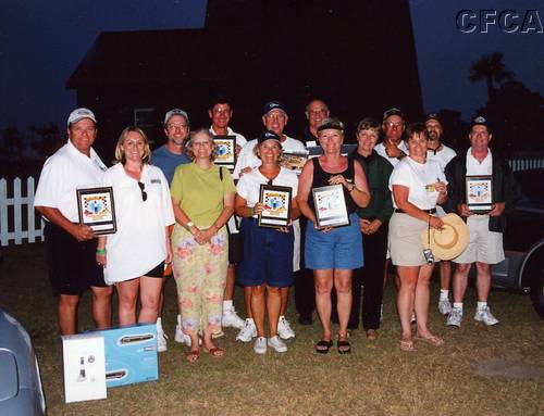 073.CFCA's post-dinner celebrants and their winnings.JPG