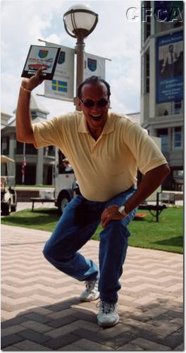 017.A happy Dr. Oscar with Kerry's Top 40 plaque.JPG