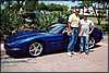 016.Dr. Oscar and Kerry pose beside the Blue Bomber.JPG