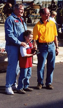 036.Neal (and his son) accepting his Top 25 trophy.JPG