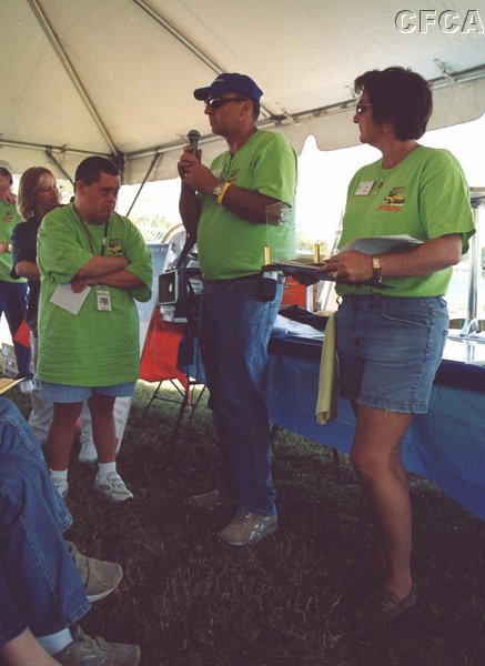 037.And as Hutch and Lisa, Master and Mistress of Ceremonies (ahem) assist Newton . . . .JPG