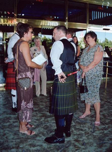 007.Lisa breaks the bad news to Eric that Elvis won't be singing at the ceremony.JPG