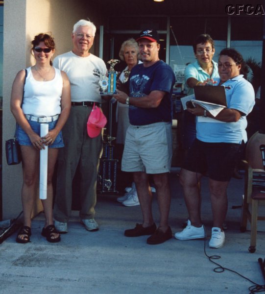 047.Denise and Todd accept their C5 trophy from Dave.JPG