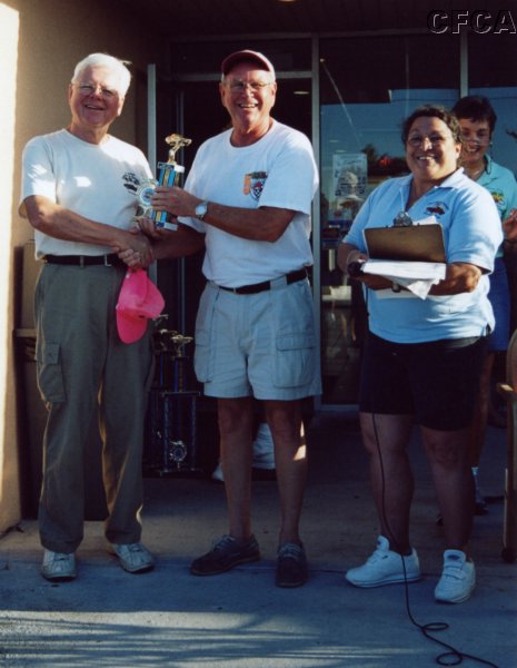 048.Jon accepts his and Pat's C6 trophy from Dave.JPG