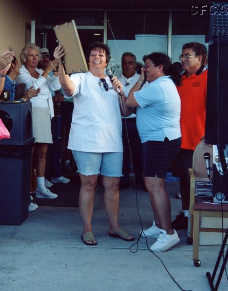 055.Joan presents Marie and Tony with the 'Monumental Perseverance in the Face of Incredible Adversity' award.JPG