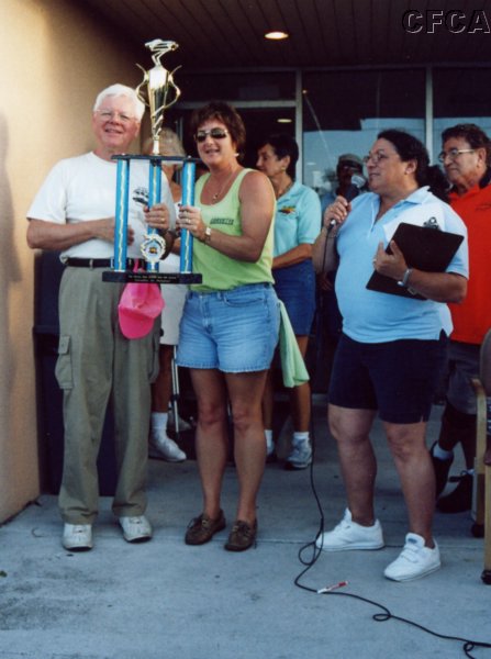 058.On behalf of CFCA, Lisa accepts the Club Participation trophy.JPG