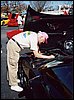 039.Giving up finding any dirt, Dave McLellan signs Lisa's Dark Bowling Green Metallic '00 valve cover.JPG.JPG