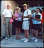 054.Arlene and Duane accept their Best in Show trophy from Dave and Marie for their C6 Mallett.JPG